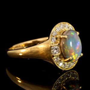 Yellow Gold Blue Green Yellow Orange Red Semi Black Opal and Diamond Ring