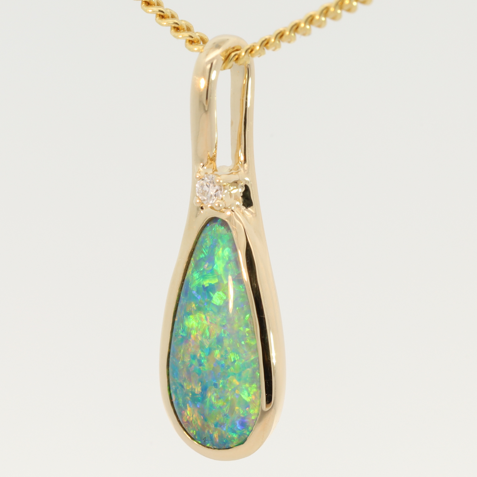 Yellow Gold Blue Green Yellow Orange Black Opal and Diamond Pendant