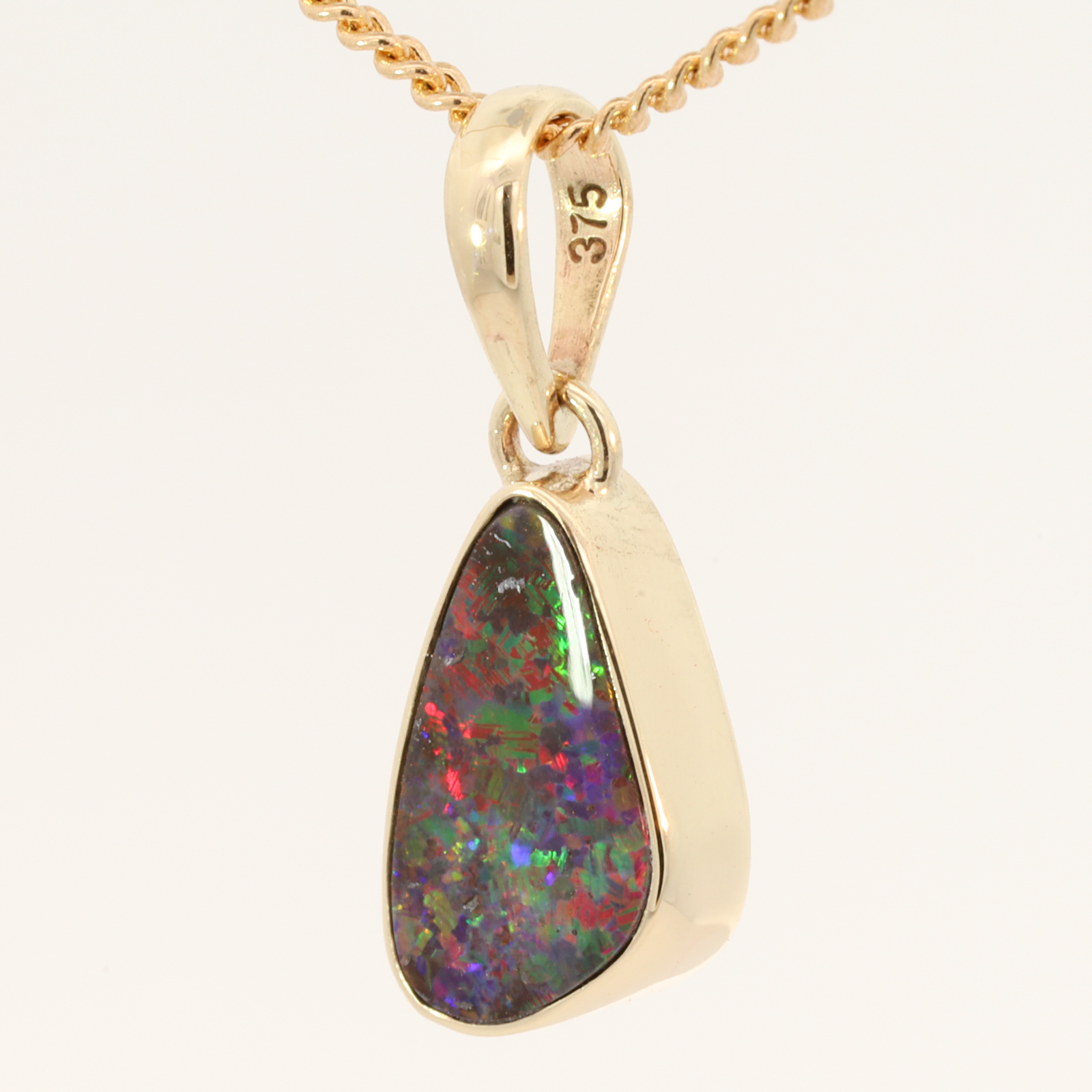 Yellow Gold Blue Green Yellow Orange Red Boulder Opal Pendant